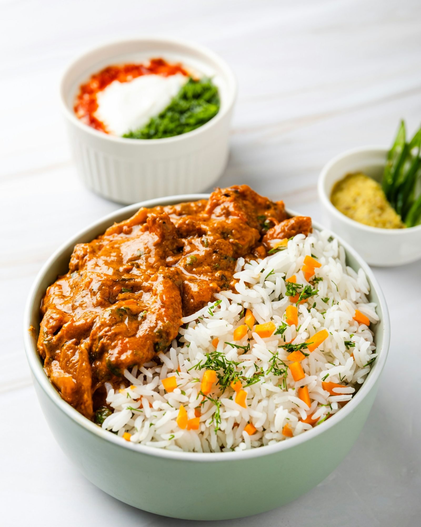 Indian butter chicken served with rice