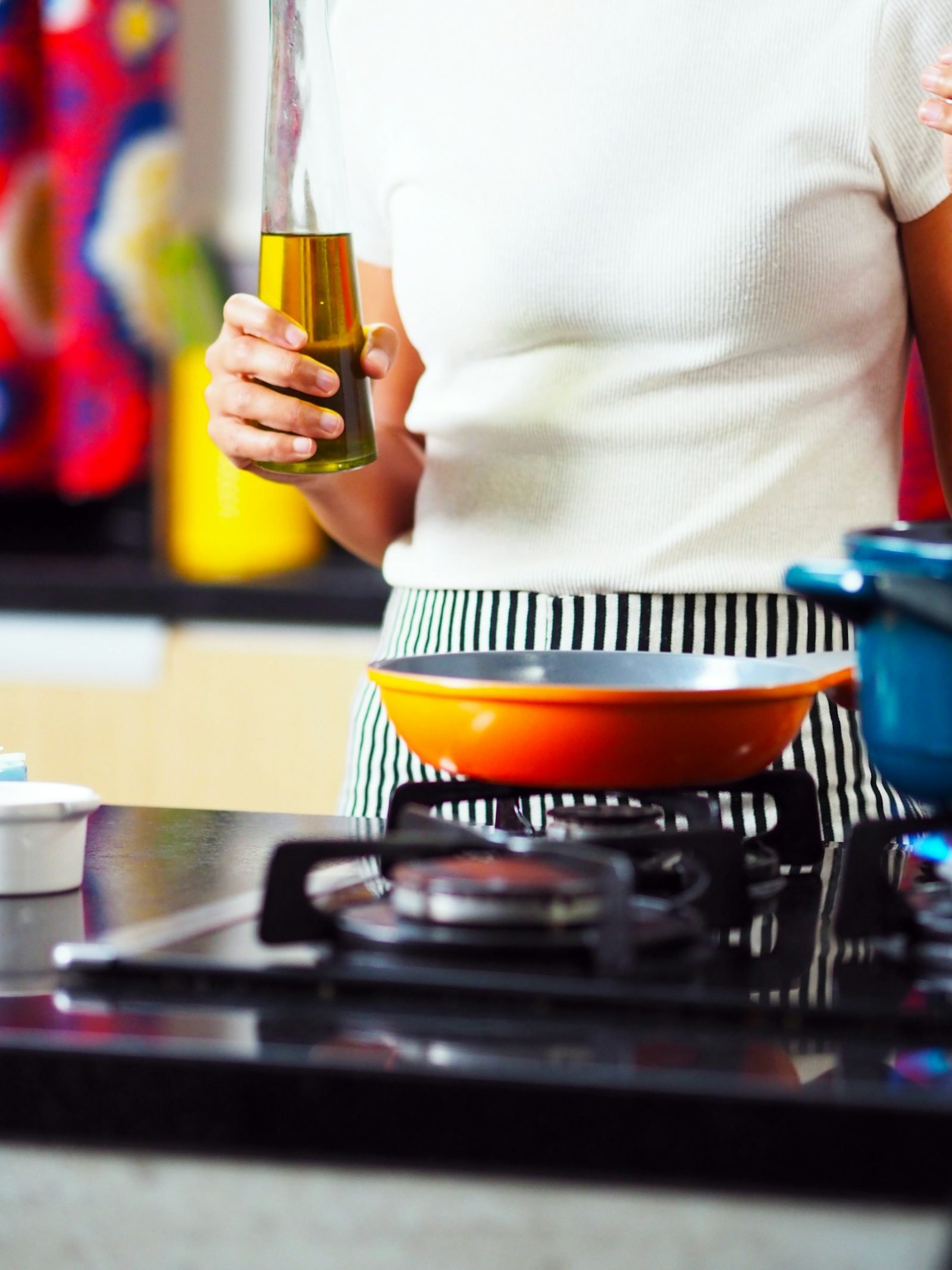 Person cooking at a gas stove